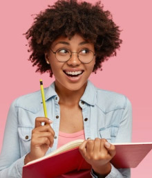 Smiling teen girl with a notebook and pen, symbolizing creative thinking and confidence in learning
